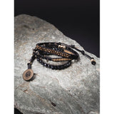 PULSERA NEGRA CARBON CON DORADO